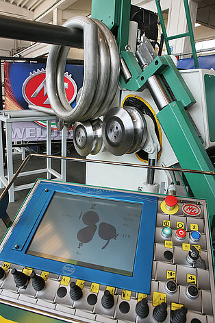 Handlingseinrichtungen für Profilbiegemaschinen